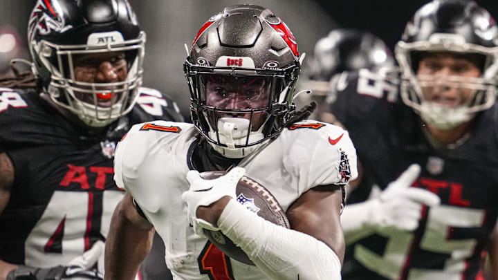 Dec 10, 2023; Atlanta, Georgia, USA; Tampa Bay Buccaneers running back Rachaad White (1) runs for a touchdown against the Atlanta Falcons during the second half at Mercedes-Benz Stadium. Mandatory Credit: Dale Zanine-Imagn Images