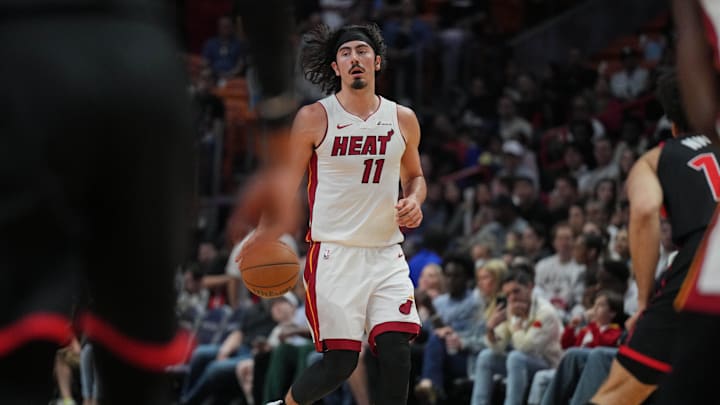 Apr 14, 2024; Miami, Florida, USA;  Miami Heat guard Jaime Jaquez Jr. (11) brings the ball up the court against the Toronto Raptors during the first half at Kaseya Center. Mandatory Credit: Jim Rassol-Imagn Images