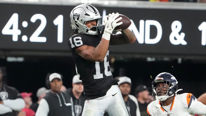 Nov 24, 2024; Paradise, Nevada, USA; Las Vegas Raiders wide receiver Jakobi Meyers (16) catches the ball against Denver Broncos cornerback Ja'Quan McMillian (29) in the fourth quarter at Allegiant Stadium. Mandatory Credit: Kirby Lee-Imagn Images