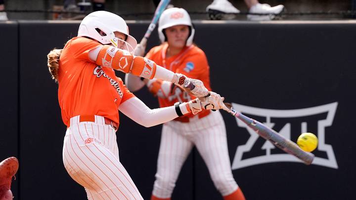 Oklahoma State Cowgirls infielder Claire Timm hits a home run. Oklahoma State Cowgirls infielder Claire Timm hits a home run.