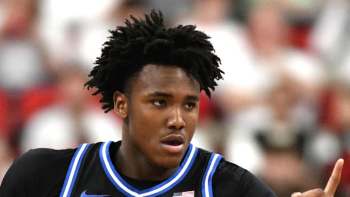 Mar 2, 2026; Raleigh, North Carolina, USA;  Duke Blue Devils center Patrick Ngongba II (21) reacts after scoring against the NC State Wolfpack during the first half at Lenovo Center. Mandatory Credit: Zachary Taft-Imagn Images