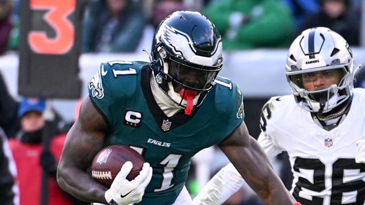 Dec 14, 2025; Philadelphia, Pennsylvania, USA; Philadelphia Eagles wide receiver A.J. Brown (11) runs with the ball against Las Vegas Raiders cornerback Darien Porter (26) during the third quarter at Lincoln Financial Field. Mandatory Credit: Eric Hartline-Imagn Images