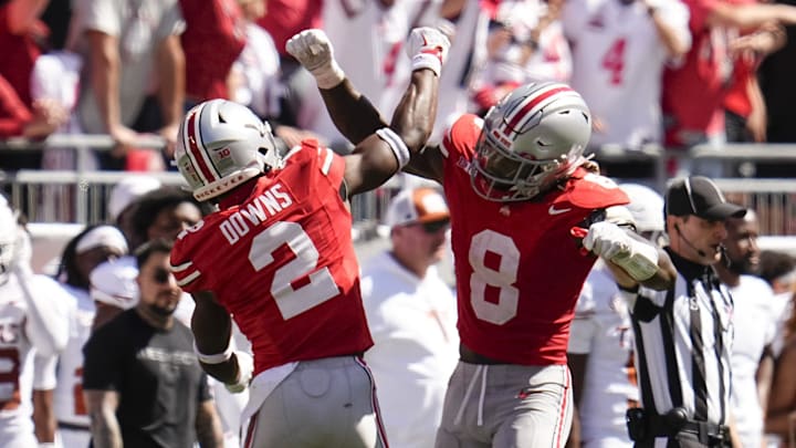 Ohio State safety Caleb Downs (2) and linebacker Arvell Reese celebrate during a game this season.
