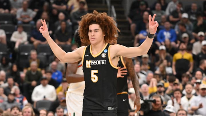 Mar 20, 2026; St. Louis, MO, USA; Missouri Tigers guard T.O. Barrett (5) reacts after a play during the second half against the Miami (FL) Hurricanes during a first round game of the men's 2026 NCAA Tournament at Enterprise Center. Mandatory Credit: Jeff Curry-Imagn Images Mar 20, 2026; St. Louis, MO, USA; Missouri Tigers guard T.O. Barrett (5) reacts after a play during the second half against the Miami (FL) Hurricanes during a first round game of the men's 2026 NCAA Tournament at Enterprise Center. Mandatory Credit: Jeff Curry-Imagn Images