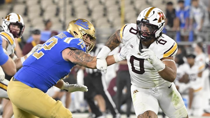 Oct 12, 2024; Pasadena, California, USA; Minnesota Golden Gophers defensive lineman Anthony Smith (0) pressures UCLA Bruins quarterback Ethan Garbers (4) as offensive lineman Garrett DiGiorgio (72) blocks during the second quarter at Rose Bowl. Mandatory Credit: Robert Hanashiro-Imagn Images Oct 12, 2024; Pasadena, California, USA; Minnesota Golden Gophers defensive lineman Anthony Smith (0) pressures UCLA Bruins quarterback Ethan Garbers (4) as offensive lineman Garrett DiGiorgio (72) blocks during the second quarter at Rose Bowl. Mandatory Credit: Robert Hanashiro-Imagn Images
