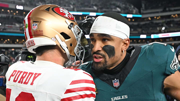 Jan 11, 2026; Philadelphia, PA, USA; San Francisco 49ers quarterback Brock Purdy (13) and Philadelphia Eagles quarterback Jalen Hurts (1) meet on the field in an NFC Wild Card Round game at Lincoln Financial Field. Mandatory Credit: Eric Hartline-Imagn Images