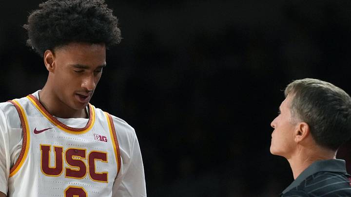 Feb 18, 2026; Los Angeles, California, USA; Southern California Trojans head coach Eric Musselman and guard Alijah Arenas (0) react against the Illinois Fighting Illini in the first half at Galen Center. 