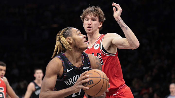 Jan 16, 2026; Brooklyn, New York, USA; Brooklyn Nets forward Noah Clowney (21) goes to the basket against Chicago Bulls forward Matas Buzelis (14) during the first quarter at Barclays Center. Mandatory Credit: Vincent Carchietta-Imagn Images