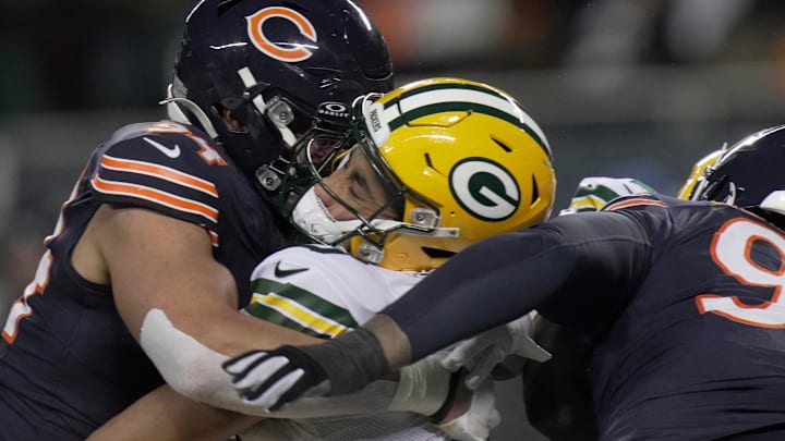 Chicago Bears defensive end Austin Booker (94) sacks and injures Green Bay Packers quarterback Jordan Love on Saturday.