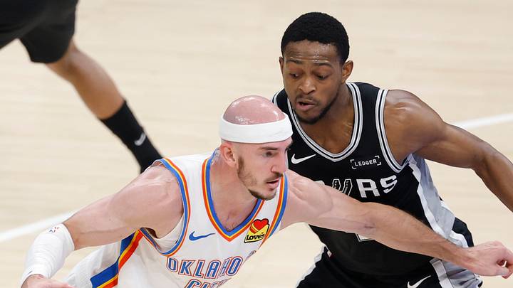 May 26, 2026; Oklahoma City, Oklahoma, USA; Oklahoma City Thunder guard Alex Caruso (9) drives against San Antonio Spurs guard De'aaron Fox (4) during the second quarter in game five of the western conference finals for the 2026 NBA playoffs at Paycom Center. Mandatory Credit: Alonzo Adams-Imagn Images May 26, 2026; Oklahoma City, Oklahoma, USA; Oklahoma City Thunder guard Alex Caruso (9) drives against San Antonio Spurs guard De'aaron Fox (4) during the second quarter in game five of the western conference finals for the 2026 NBA playoffs at Paycom Center. Mandatory Credit: Alonzo Adams-Imagn Images