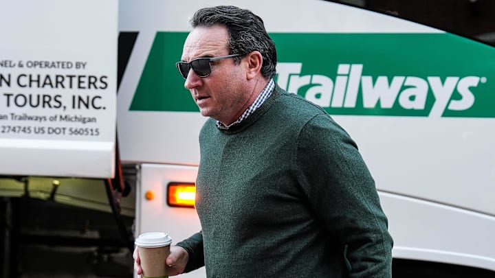 Michigan State head coach Jonathan Smith walks off the bus before the Michigan game at Michigan Stadium in Ann Arbor on Saturday, Oct. 26, 2024.