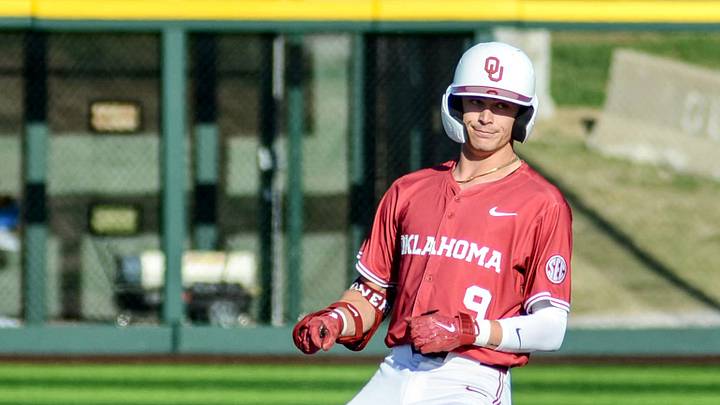 Oklahoma infielder Camden Johnson reaches base against Florida. Oklahoma infielder Camden Johnson reaches base against Florida.