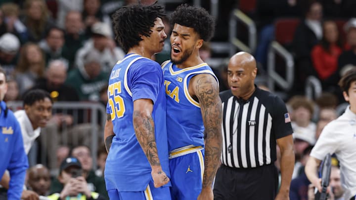 Mar 13, 2026; Chicago, IL, USA; UCLA Bruins guard Donovan Dent (2) celebrates with guard Skyy Clark (55) during the second half at United Center. Mandatory Credit: Kamil Krzaczynski-Imagn Images