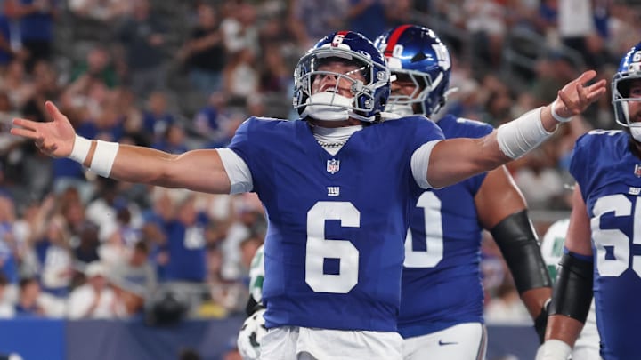 Aug 16, 2025; East Rutherford, New Jersey, USA; New York Giants quarterback Jaxson Dart (6) celebrates his rushing touchdown during the second half against the New York Jets at MetLife Stadium. Aug 16, 2025; East Rutherford, New Jersey, USA; New York Giants quarterback Jaxson Dart (6) celebrates his rushing touchdown during the second half against the New York Jets at MetLife Stadium.