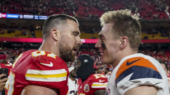 Dec 25, 2025; Kansas City, Missouri, USA; Denver Broncos quarterback Bo Nix (10) and Kansas City Chiefs tight end Travis Kelce (87) after the game at GEHA Field at Arrowhead Stadium. Mandatory Credit: Denny Medley-Imagn Images