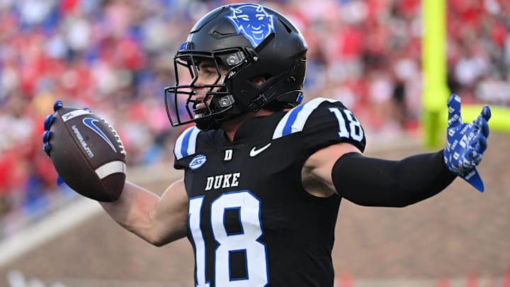 Sep 20, 2025; Durham, North Carolina, USA;  Duke Blue Devils wide receiver Cooper Barkate (18) celebrates a touchdown during the third quarter against the NC State Wolfpack at Wallace Wade Stadium. Mandatory Credit: Zachary Taft-Imagn Images