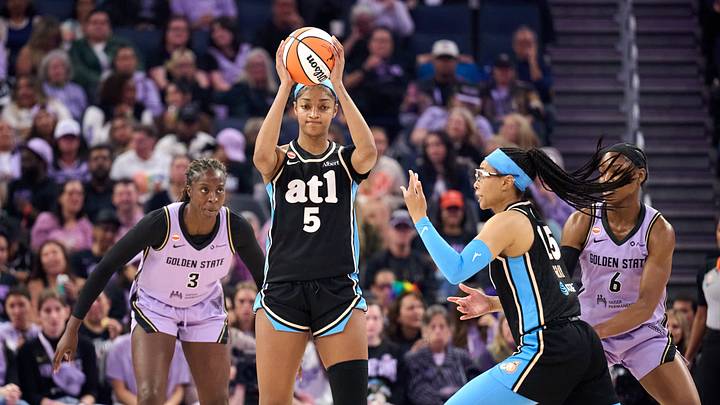 Atlanta Dream forward Angel Reese (5) prepares to pass the ball to guard Allisha Gray (15) against the Golden State Valkyries. Atlanta Dream forward Angel Reese (5) prepares to pass the ball to guard Allisha Gray (15) against the Golden State Valkyries.
