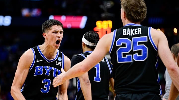 Egor Demin #3 of the Brigham Young Cougars celebrates after a play against the Wisconsin Badgers in the first half in the second round of the NCAA Men's Basketball Tournament at Ball Arena on March 22, 2025 in Denver, Colorado.