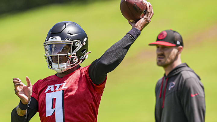 Atlanta Falcons quarterback Michael Penix Jr. throws in front of then-quarterback coach T.J. Yates, who was promoted Thursday. Atlanta Falcons quarterback Michael Penix Jr. throws in front of then-quarterback coach T.J. Yates, who was promoted Thursday.