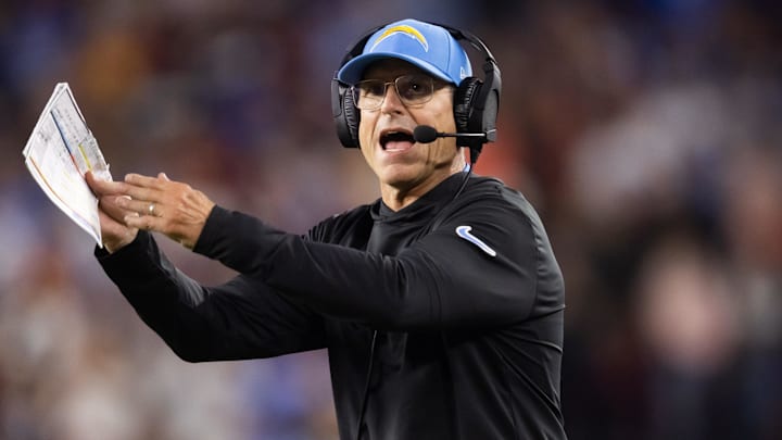 Oct 21, 2024; Glendale, Arizona, USA; Los Angeles Chargers head coach Jim Harbaugh reacts against the Arizona Cardinals at State Farm Stadium. Mandatory Credit: Mark J. Rebilas-Imagn Images