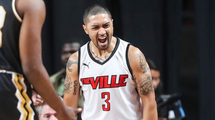 The Ville's Peyton Siva reacts while Jackson TN Underdawg's Jaylen Barford sits on the court at the TBT second round game of the Louisville Regional at Freedom Hall July 27, 2023.