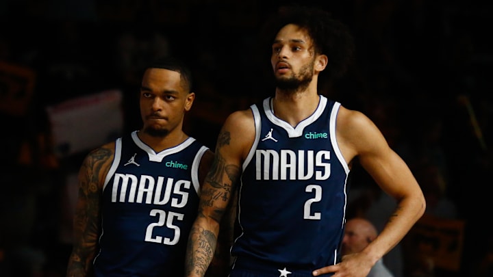 Apr 18, 2025; Memphis, Tennessee, USA; Dallas Mavericks forward P.J. Washington (25) and center Dereck Lively II (2) waits for play to start prior to the game against the Memphis Grizzlies at FedExForum. Mandatory Credit: Petre Thomas-Imagn Images
