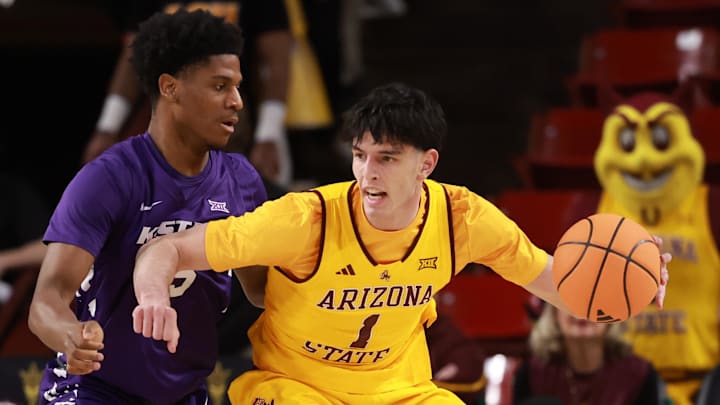 Jan 10, 2026; Tempe, Arizona, USA; Arizona State Sun Devils forward Santiago Trouet (1) moves the ball against Kansas State Wildcats forward Taj Manning (15) in the first half at Desert Financial Arena. Mandatory Credit: Mark J. Rebilas-Imagn Images Jan 10, 2026; Tempe, Arizona, USA; Arizona State Sun Devils forward Santiago Trouet (1) moves the ball against Kansas State Wildcats forward Taj Manning (15) in the first half at Desert Financial Arena. Mandatory Credit: Mark J. Rebilas-Imagn Images