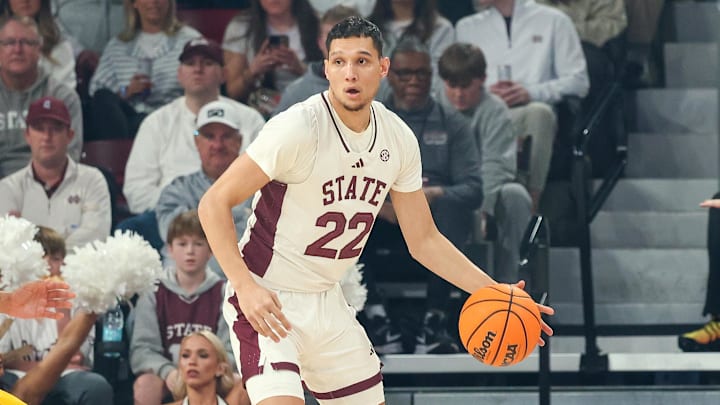 Feb 1, 2025; Starkville, Mississippi, USA; Mississippi State Bulldogs forward RJ Melendez (22) handles the ball against Missouri Tigers guard Tamar Bates (2) during the first half at Humphrey Coliseum. Mandatory Credit: Wesley Hale-Imagn Images