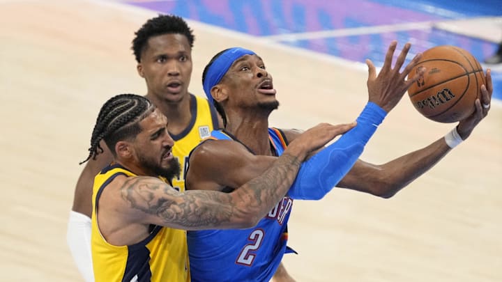 Jun 8, 2025; Oklahoma City, Oklahoma, USA; Oklahoma City Thunder guard Shai Gilgeous-Alexander (2) shoots the ball against Indiana Pacers forward Obi Toppin (1) during the second half during game two of the 2025 NBA Finals at Paycom Center. Mandatory Credit: Kyle Terada-Imagn Images