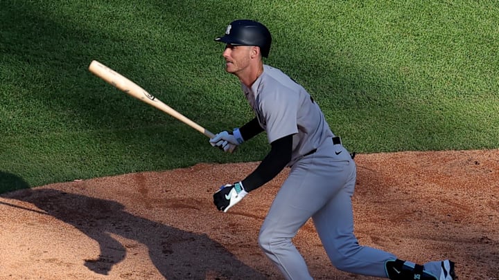 Jul 5, 2025; New York City, New York, USA; New York Yankees first baseman Cody Bellinger (35) follows through on a two run double against the New York Mets during the sixth inning at Citi Field. Mandatory Credit: Brad Penner-Imagn Images