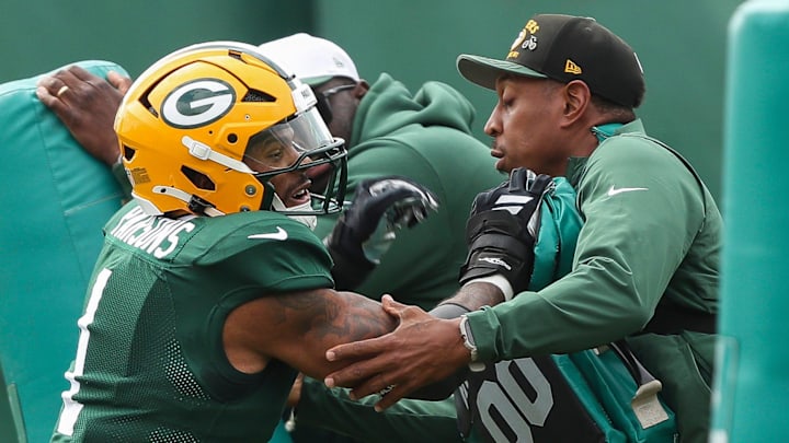 Green Bay Packers defensive end Micah Parsons (1) runs through a drill during practice on Wednesday.