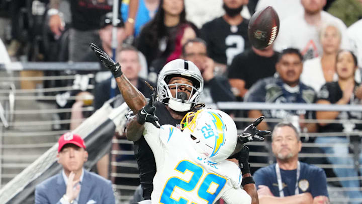 Sep 15, 2025; Paradise, Nevada, USA; Los Angeles Chargers cornerback Tarheeb Still (29) breaks up a pass intended for Las Vegas Raiders wide receiver Dont'e Thornton Jr. (10) during the second quarter at Allegiant Stadium. Mandatory Credit: Stephen R. Sylvanie-Imagn Images Sep 15, 2025; Paradise, Nevada, USA; Los Angeles Chargers cornerback Tarheeb Still (29) breaks up a pass intended for Las Vegas Raiders wide receiver Dont'e Thornton Jr. (10) during the second quarter at Allegiant Stadium. Mandatory Credit: Stephen R. Sylvanie-Imagn Images