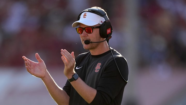 Aug 30, 2025; Los Angeles, California, USA; Southern California Trojans head coach Lincoln Riley watches from the sidelines against the Missouri State Bears in the first half at United Airlines Field at Los Angeles Memorial Coliseum. Mandatory Credit: Kirby Lee-Imagn Images