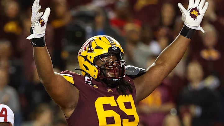 Oct 5, 2024; Minneapolis, Minnesota, USA; Minnesota Golden Gophers offensive lineman Aireontae Ersery (69) celebrates quarterback Max Brosmer's (16) touchdown against the USC Trojans during the first half at Huntington Bank Stadium. Mandatory Credit: Matt Krohn-Imagn Images Oct 5, 2024; Minneapolis, Minnesota, USA; Minnesota Golden Gophers offensive lineman Aireontae Ersery (69) celebrates quarterback Max Brosmer's (16) touchdown against the USC Trojans during the first half at Huntington Bank Stadium. Mandatory Credit: Matt Krohn-Imagn Images