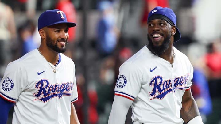 Sep 18, 2024; Arlington, Texas, USA;  Texas Rangers right fielder Adolis Garcia (53) celebrates with Texas Rangers second baseman Marcus Semien (2) after the game against the Toronto Blue Jays at Globe Life Field. 