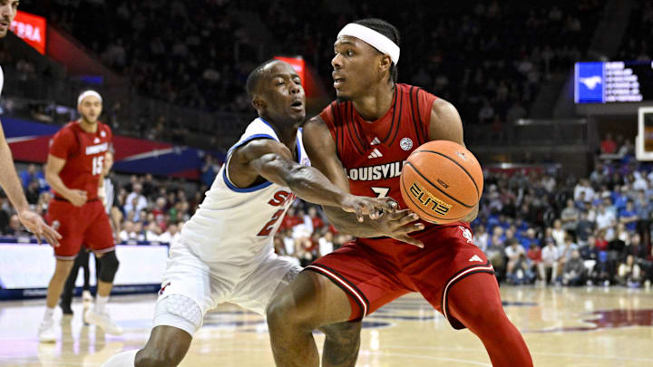 Feb 17, 2026; Dallas, Texas, USA; SMU Mustangs guard Boopie Miller (2) attempts to knock the ball away from Louisville Cardinals guard Ryan Conwell (3) during the first half at Moody Coliseum. Mandatory Credit: Jerome Miron-Imagn Images