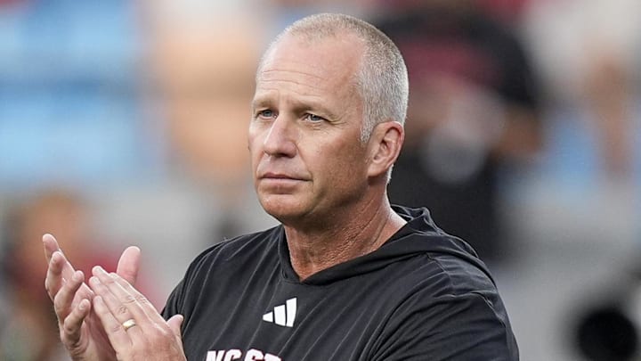 Sep 7, 2024; Charlotte, North Carolina, USA; North Carolina State Wolfpack head coach Dave Doeren during pregame activities against the Tennessee Volunteers at the Dukes Mayo Classic at Bank of America Stadium. Mandatory Credit: Jim Dedmon-Imagn Images Sep 7, 2024; Charlotte, North Carolina, USA; North Carolina State Wolfpack head coach Dave Doeren during pregame activities against the Tennessee Volunteers at the Dukes Mayo Classic at Bank of America Stadium. Mandatory Credit: Jim Dedmon-Imagn Images