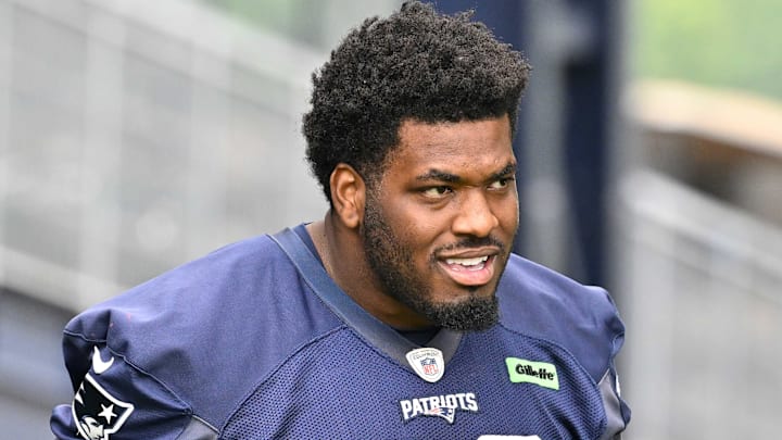 Jun 9, 2025; Foxborough, MA, USA; New England Patriots defensive tackle Joshua Farmer (92) walks to the practice fields at Gillette Stadium. Mandatory Credit: Eric Canha-Imagn Images