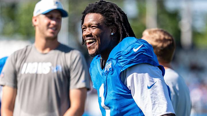 Detroit Lions wide receiver Jameson Williams (1) laughs during training camp practice Detroit Lions wide receiver Jameson Williams (1) laughs during training camp practice