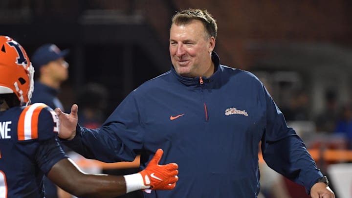 Aug 29, 2024; Champaign, Illinois, USA; Illinois Fighting Illini head coach Bret Bielema greets running back Ca'Lil Valentine (5) before the first half at Memorial Stadium. Mandatory Credit: Ron Johnson-Imagn Images Aug 29, 2024; Champaign, Illinois, USA; Illinois Fighting Illini head coach Bret Bielema greets running back Ca'Lil Valentine (5) before the first half at Memorial Stadium. Mandatory Credit: Ron Johnson-Imagn Images