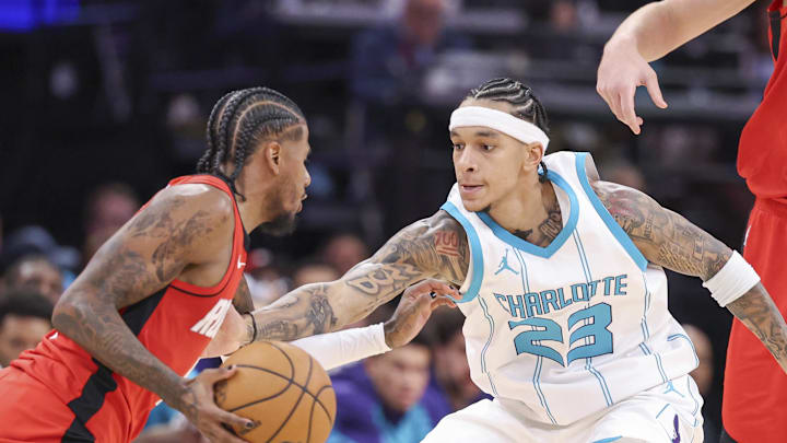 Oct 23, 2024; Houston, Texas, USA; Charlotte Hornets guard Tre Mann (23) defends against Houston Rockets guard Jalen Green (4) during the fourth quarter at Toyota Center. Mandatory Credit: Troy Taormina-Imagn Images Oct 23, 2024; Houston, Texas, USA; Charlotte Hornets guard Tre Mann (23) defends against Houston Rockets guard Jalen Green (4) during the fourth quarter at Toyota Center. Mandatory Credit: Troy Taormina-Imagn Images