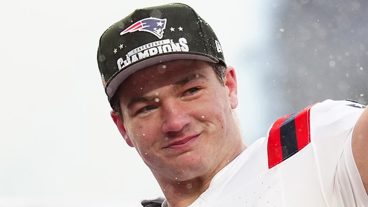 Jan 25, 2026; Denver, CO, USA; New England Patriots quarterback Drake Maye (10) holds the AFC Championship trophy while speaking to the media after defeating the Denver Broncos in the 2026 AFC Championship Game at Empower Field at Mile High. Mandatory Credit: Ron Chenoy-Imagn Images