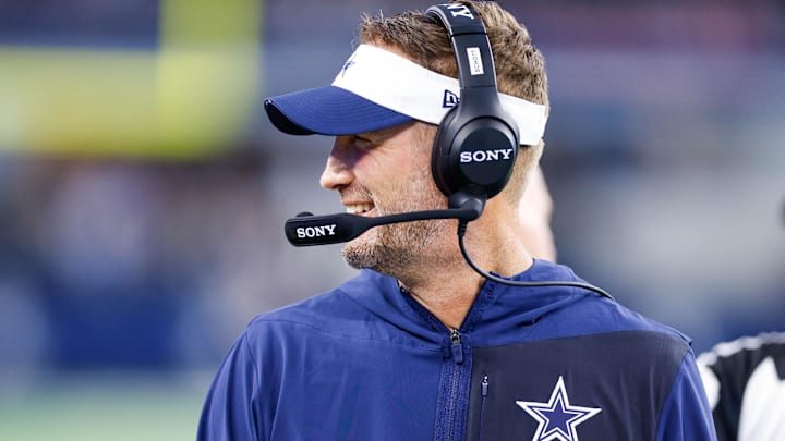 Aug 22, 2025; Arlington, Texas, USA; Dallas Cowboys head coach Brian Schottenheimer smiles during the first quarter against the Atlanta Falcons at AT&T Stadium. Mandatory Credit: Andrew Dieb-Imagn Images