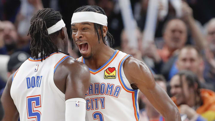Dec 21, 2022; Oklahoma City, Oklahoma, USA; Oklahoma City Thunder guard Shai Gilgeous-Alexander (2) and Oklahoma City Thunder guard Luguentz Dort (5) celebrate at the end of their game against the Portland Trial Blazers at Paycom Center. Oklahoma City won 101-98. Mandatory Credit: Alonzo Adams-USA TODAY Sports