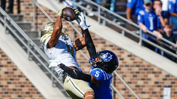 Oct 18, 2025; Durham, North Carolina, USA; Georgia Tech Yellow Jackets wide receiver Isiah Canion (4) catches the pass past Duke Blue Devils cornerback Kimari Robinson (5) during the second half of the game at Wallace Wade Stadium. Mandatory Credit: Jaylynn Nash-Imagn Images Oct 18, 2025; Durham, North Carolina, USA; Georgia Tech Yellow Jackets wide receiver Isiah Canion (4) catches the pass past Duke Blue Devils cornerback Kimari Robinson (5) during the second half of the game at Wallace Wade Stadium. Mandatory Credit: Jaylynn Nash-Imagn Images