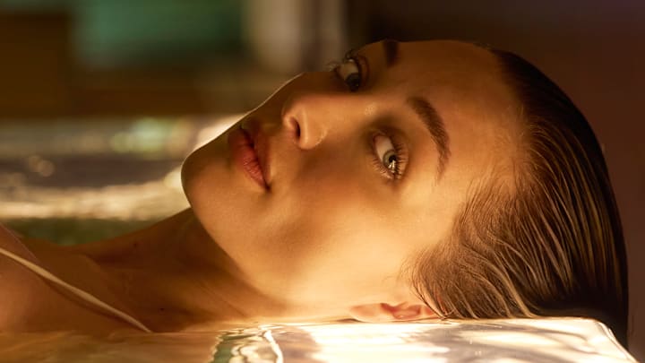 Penny Lane was photographed by Derek Kettela in Switzerland. Swimsuit by Shani Shemer.