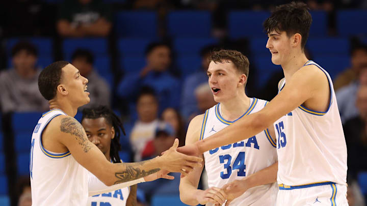 Jan 21, 2025; Los Angeles, California, USA; UCLA Bruins center Aday Mara (15) is greeted by guard Kobe Johnson (0) during the second half against the Wisconsin Badgers at Pauley Pavilion presented by Wescom. Mandatory Credit: Kiyoshi Mio-Imagn Images Jan 21, 2025; Los Angeles, California, USA; UCLA Bruins center Aday Mara (15) is greeted by guard Kobe Johnson (0) during the second half against the Wisconsin Badgers at Pauley Pavilion presented by Wescom. Mandatory Credit: Kiyoshi Mio-Imagn Images
