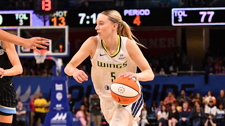 May 29, 2025; Chicago, Illinois, USA; Dallas Wings guard Paige Bueckers (5) controls the ball during the second half against the Chicago Sky at the Wintrust Arena. Mandatory Credit: Patrick Gorski-Imagn Images