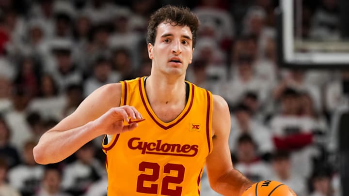 Jan 17, 2026; Cincinnati, Ohio, USA;  Iowa State Cyclones forward Milan Momcilovic (22) dribbles the ball against the Cincinnati Bearcats in the first half at Fifth Third Arena.