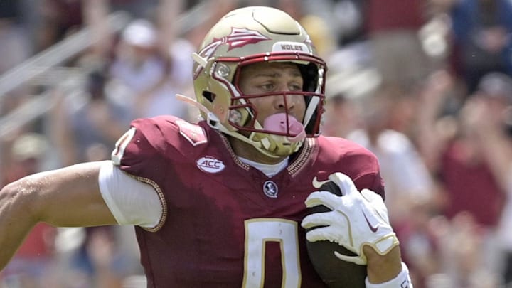 Sep 6, 2025; Tallahassee, Florida, USA; Florida State Seminoles wide receiver Duce Robinson (0) catches a touchdown during the first half against the East Texas A&M at Doak S. Campbell Stadium. Mandatory Credit: Melina Myers-Imagn Images